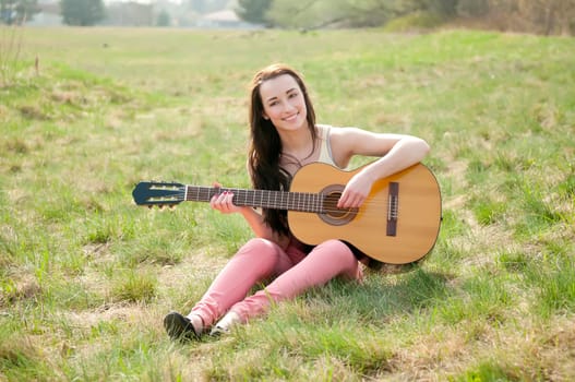 Woman plays guitar