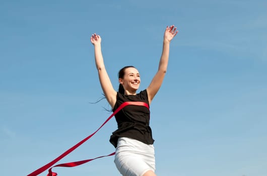 Woman crosses the finish line and wins