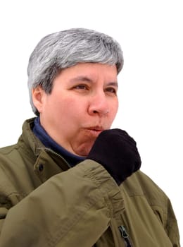 middle aged woman in winter, coughing into gloved hand