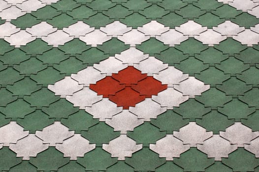 Barn roof multicolored pattern in red, green, and white