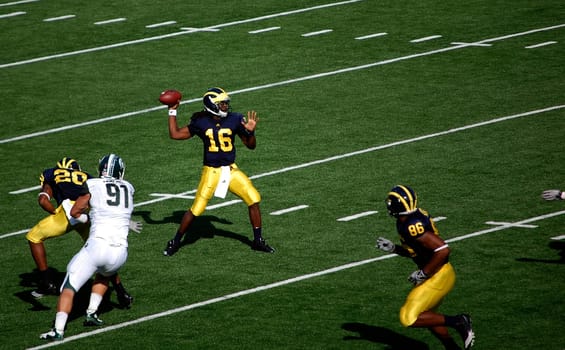 ANN ARBOR, MI - OCTOBER 09: Denard Robinson throws a pass during the Michigan vs. Michigan State football game October 9, 2010. Michigan lost the game 34-17.