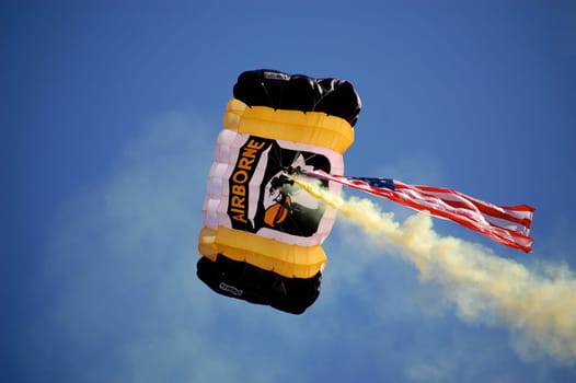 ANN ARBOR, MI - OCTOBER 09: 101st Airborne Division Parachute Demonstration Team member parachutes into Michigan Stadium before the Michigan vs. Michigan State football game October 9, 2010.
