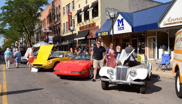 ANN ARBOR, MI - JULY 13: 1955 MG, 1994 Corvette, and 1970 Ferrari at the Rolling Sculpture car show July 13, 2012 in Ann Arbor, MI.