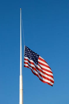 American flag at half mast, flag down