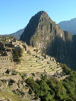 Classic Machu Picchu sunrise, blue skies