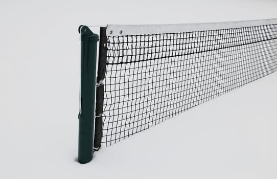 Tennis court half buried in snow in winter