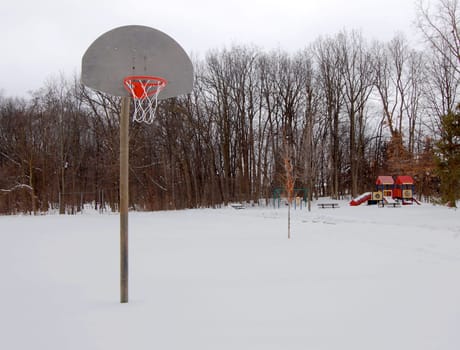 basketball hoop and playground in the snow