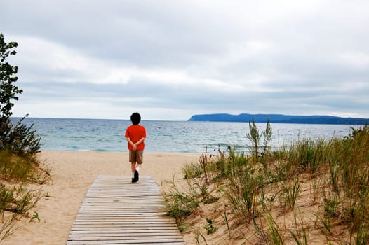 boy walking to beach, Leelanau State Park, Michigan