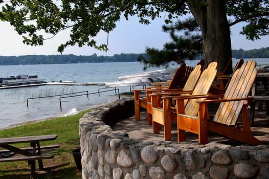 deck chairs overlooking lake with boats