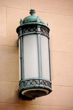 Weathered sconce on stone wall, vintage with patina