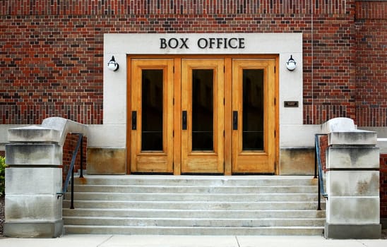 Theater box office, brick walls, three doors
