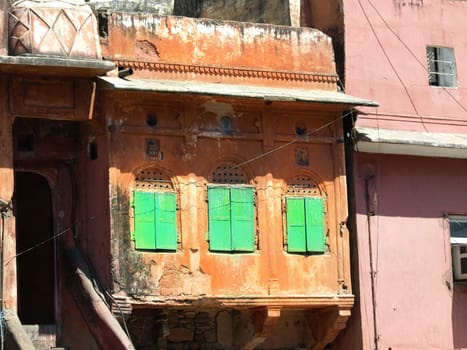 old red house with green windows in Jaipur,India