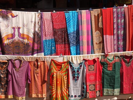 colorful dresses  scarfs and shirts on the open market in India