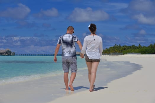 happy young couple relax and take fresh drink at summer vacation
