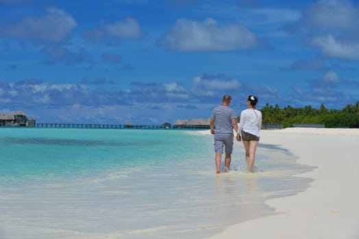 happy young couple relax and take fresh drink at summer vacation