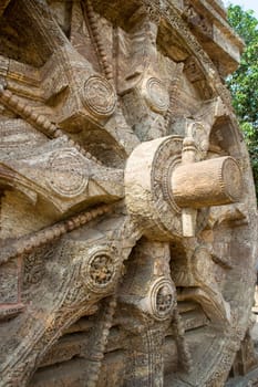 Close up of stone wheel spokes, axle and wedge pin at Sun Temple, Konark, Orissa, India, Asia