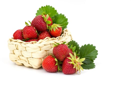 fresh strawberries in a basket on white background