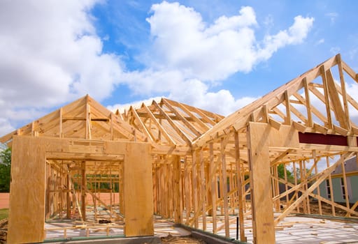 American residential wooden house construction detail in blue sunny day sky