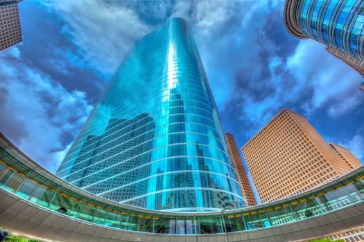 Houston downtown skyscrapers disctict with mirror blue sky reflection