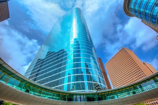Houston downtown skyscrapers disctict with mirror blue sky reflection