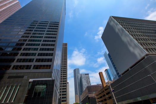 Houston downtown skyscrapers disctict with mirror blue sky reflection