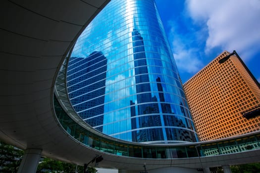 Houston downtown skyscrapers disctict with mirror blue sky reflection