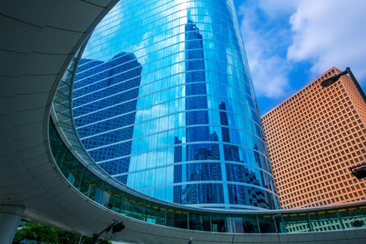 Houston downtown skyscrapers disctict with mirror blue sky reflection
