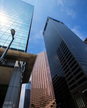 Houston downtown skyscrapers disctict with mirror blue sky reflection