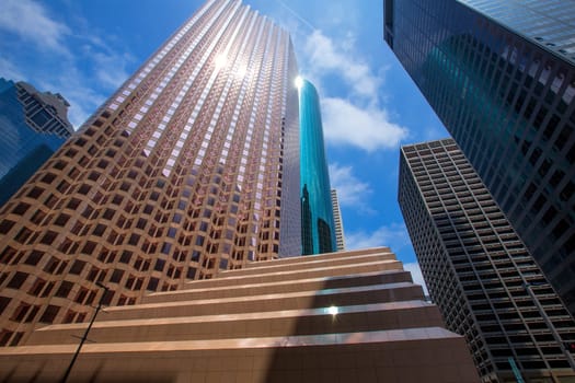 Houston downtown skyscrapers disctict with mirror blue sky reflection