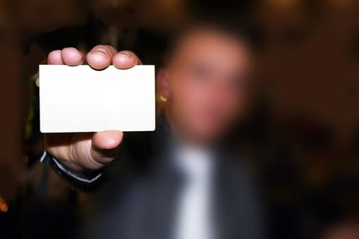 Man with empty white card