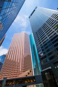 Houston downtown skyscrapers disctict with mirror blue sky reflection