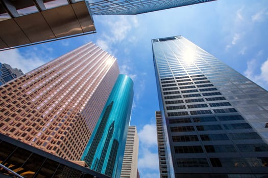 Houston downtown skyscrapers disctict with mirror blue sky reflection