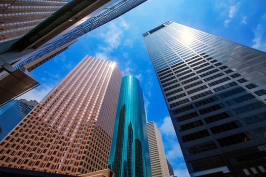 Houston downtown skyscrapers disctict with mirror blue sky reflection