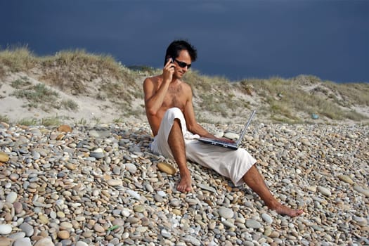Surfer working on his laptop