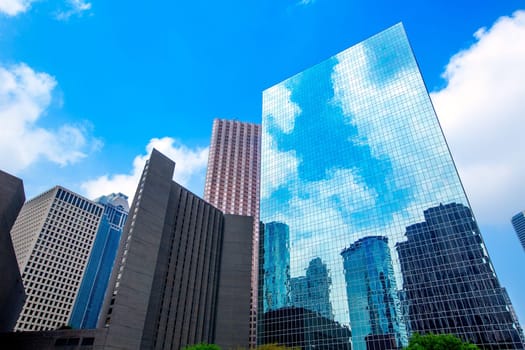 Houston downtown skyscrapers disctict with mirror blue sky reflection