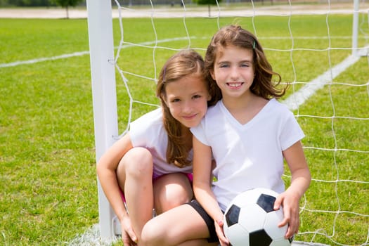 Soccer football kid girls playing on sports outdoor field