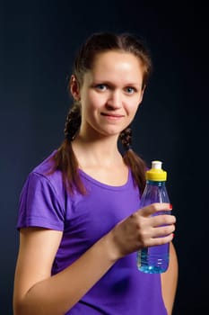 young woman with a bottle of water