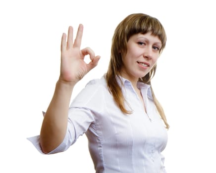 Young girl shows sign ok on a white background