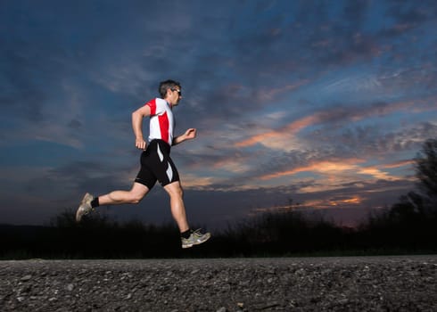 Joggers at sunset