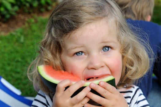 girl is eating water melon
