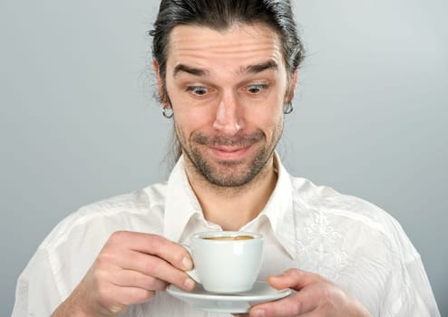 Man is drinking coffee