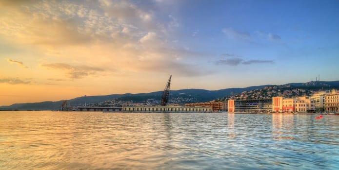 View of Trieste harbor at sunset, Italy