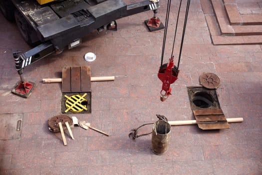 Tools next to the Manhole opened for maintenance