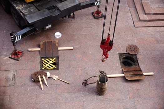 Tools next to the Manhole opened for maintenance
