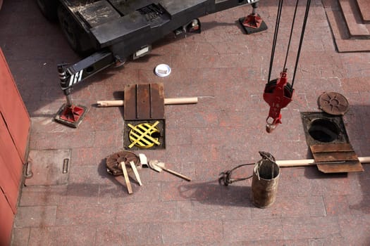 Tools next to the Manhole opened for maintenance