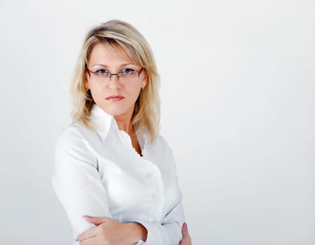 Young attractive business woman on a light background