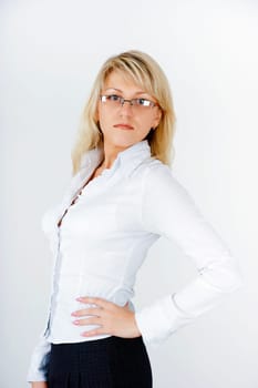 Young attractive business woman on a light background