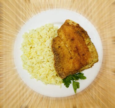fried breaded tilapia served with rice and herbs
