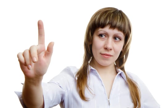 young girl pushes imaginary button on a white background