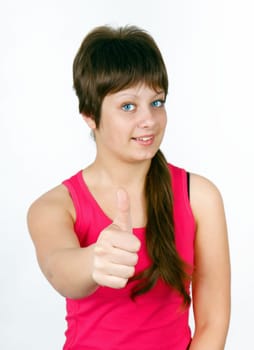 girl with thumb up on a light background